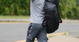 Prisoner giving the middle finger while leaving prison.