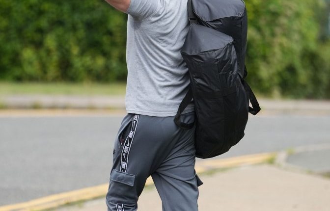 Prisoner giving the middle finger while leaving prison.