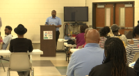 Residents of the Sand Hills community voting on the future of Weed School at Mondays public meeting