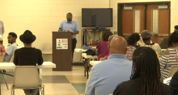 Residents of the Sand Hills community voting on the future of Weed School at Mondays public meeting