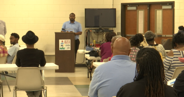 Residents of the Sand Hills community voting on the future of Weed School at Mondays public meeting