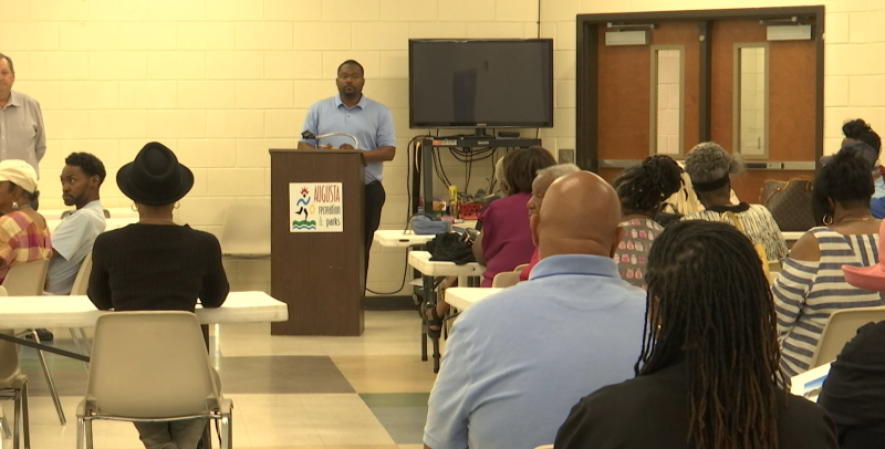 Residents of the Sand Hills community voting on the future of Weed School at Mondays public meeting