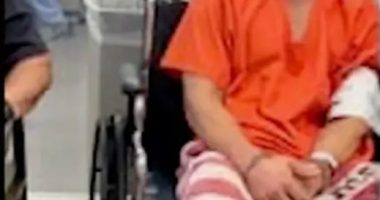 Injured inmate in wheelchair.