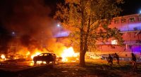 Firefighters battling a fire at the site of a Russian drone strike in Kyiv, Ukraine.