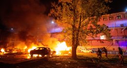 Firefighters battling a fire at the site of a Russian drone strike in Kyiv, Ukraine.