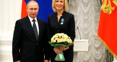 Maria Zakharova and Vladimir Putin.