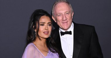 Salma Hayek wows in a caped lilac gown as she cosies up to husband