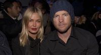 Sam Worthington and Lara Bingle barely raise a smile at Fashion Week