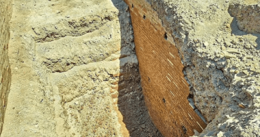 Excavated remains of an ancient brick wall.