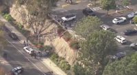 Aerial view of a car accident scene with emergency responders.