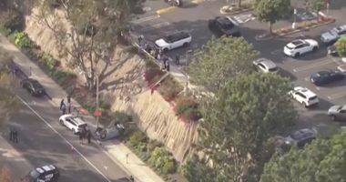 Aerial view of a car accident scene with emergency responders.