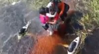 People being rescued from floodwaters.