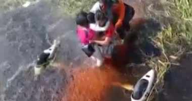 People being rescued from floodwaters.