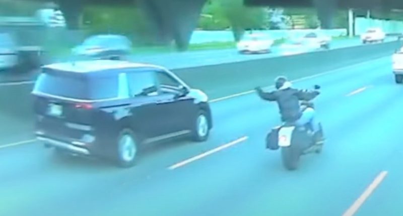 Dashcam footage of a minivan hitting a motorcyclist.
