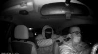 Night vision image of a carjacking.