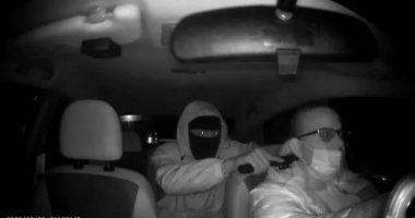 Night vision image of a carjacking.