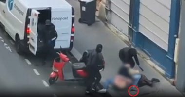 Footage of three masked men forcing a woman into a van.