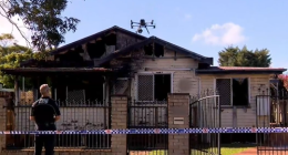 A nine-year-old boy is dead and a woman is under police guard after a suspicious house fire in Toowoomba, Queensland. ï»¿