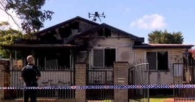 A nine-year-old boy is dead and a woman is under police guard after a suspicious house fire in Toowoomba, Queensland. ï»¿