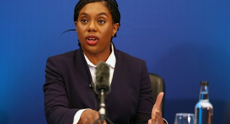 Kemi Badenoch speaking at a press conference.