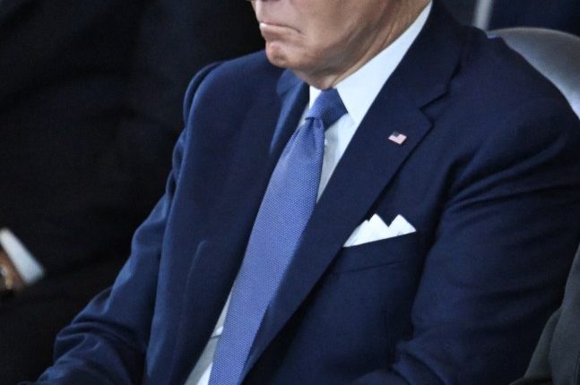 President Biden seated at an inauguration ceremony.