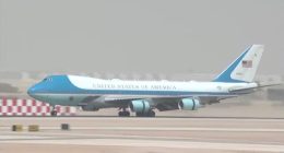 Air Force One landing at an airport.