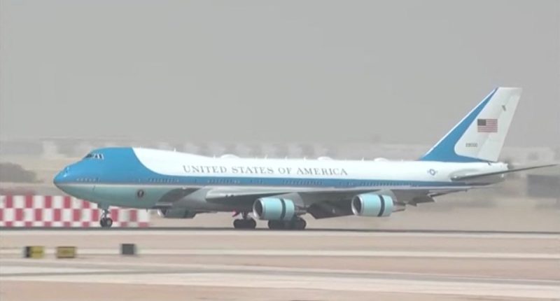 Air Force One landing at an airport.