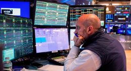 A trader works on the floor of the New York Stock Exchange