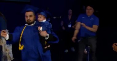 Video shows UB graduate who brought baby on stage chased by campus police