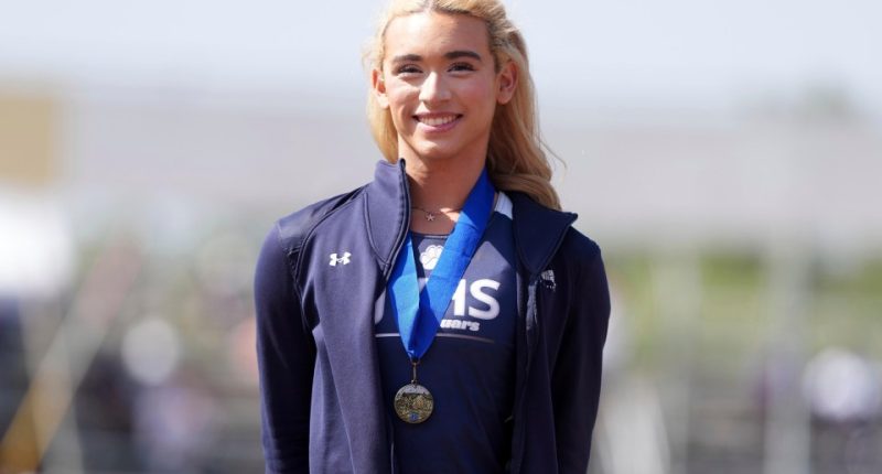 AB Hernandez of Jurupa Valley, wearing a medal after winning the girls' long jump.