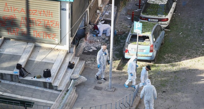Forensic experts investigating a bomb explosion scene.