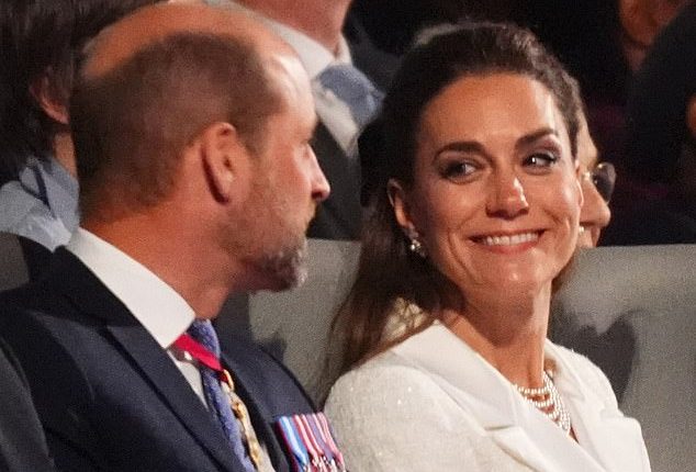 They've been married for more than a decade - yet the Prince and Princess of Wales appeared more loved up than ever as they joined the King and Queen at the VE Day concert on Thursday evening (pictured)
