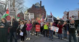 Protesters gather outside federal court ahead of a hearing for Mohsen Mahdawi, a Palestinian man arrested at a Vermont immigration office during an interview about finalizing his U.S. citizenship and a legal permanent resident who led protests against the war in Gaza at Columbia University, Wednesday, April 23, 2025 in Burlington, Vt. (AP Photo/Amanda Swinhart)