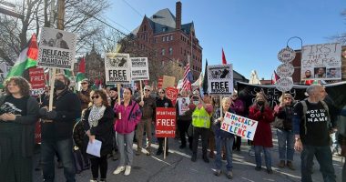 Protesters gather outside federal court ahead of a hearing for Mohsen Mahdawi, a Palestinian man arrested at a Vermont immigration office during an interview about finalizing his U.S. citizenship and a legal permanent resident who led protests against the war in Gaza at Columbia University, Wednesday, April 23, 2025 in Burlington, Vt. (AP Photo/Amanda Swinhart)