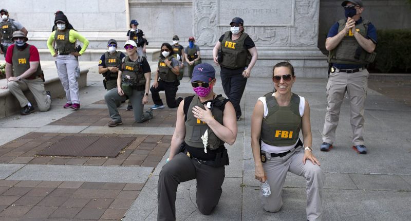 FBI agents seen kneeling in infamous George Floyd protest picture learn their fate