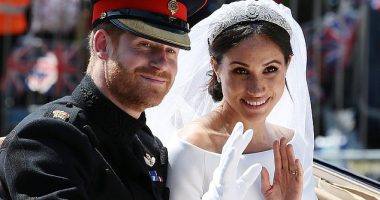 Harry and Meghan wave from the Ascot Landau Carriage during their carriage procession on the Long Walk as they head back towards Windsor Castle after their wedding ceremony