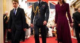 Prince George walks in front of his parents as they arrive for a tea party organised for the veterans at Buckingham Palace on Monday