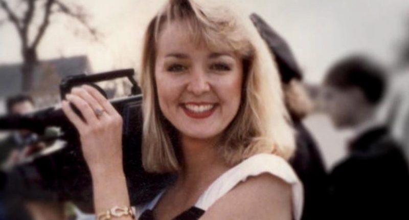 Jodi Huisentruit is pictured holding a camera.