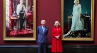The King and Queen pose with their official Coronation state portraits at the National Gallery