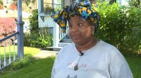 A woman poses for an interview.