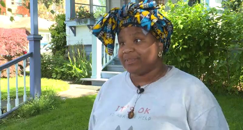 A woman poses for an interview.