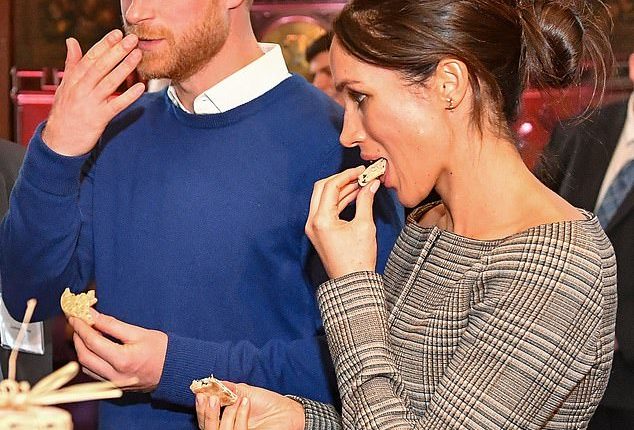 Harry and Meghan taste traditional Welsh cakes during a visit to Cardiff Castle in January 2018