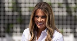 First lady Melania Trump participates in flag decorating during a Take Our Child to Work Day event in the Jacqueline Kennedy Garden at the White House, Tuesday, May 20, 2025, in Washington. (AP Photo/Alex Brandon)