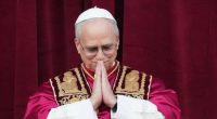 Pope Leo XIV holds his hands in prayer