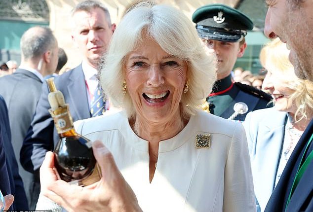 Queen Camilla was spotted tucking into a few tipples this afternoon as she enjoyed the best of Italian hospitality during a state visit to Rome (pictured)