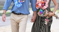 Prince Harry and Meghan Markle walk along Bondi Beach in Sydney, Australia, in 2018