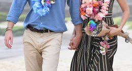 Prince Harry and Meghan Markle walk along Bondi Beach in Sydney, Australia, in 2018