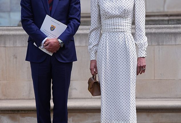 The Prince and Princess of Wales lay flowers at the Innocent Victims' Memorial following a Service of Thanksgiving at Westminster Abbey in London today