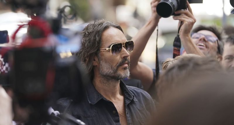 Russell Brand granted conditional bail after appearing in London court on rape and assault charges
