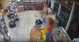 Shirtless armed robber caught on CCTV holding up service station